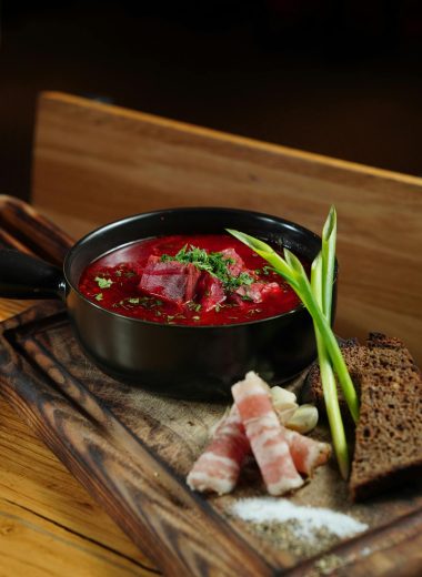 ### **The Cultural Significance of Borscht:** Borscht is more than just a meal; it’s a cultural symbol deeply rooted in the traditions of Ukraine and other Eastern European countries. Passed down through generations, this humble yet flavorful soup has become a national dish, often enjoyed during family gatherings, festive occasions, or even as a comforting daily staple. Each family has its own version, with recipes varying slightly by region and personal preference—some prefer a more sour version with extra vinegar, while others add more sweetness with a hint of sugar. Despite its many variations, borscht remains a dish that brings people together around the table, embodying warmth and hospitality. In addition to its cultural importance, borscht has also gained international recognition due to its versatility and health benefits. As more people seek nutrient-dense, plant-based meals, this vibrant beet soup has found a place in kitchens worldwide. Whether served hot or cold, as a starter or a main course, borscht’s blend of simple ingredients delivers a satisfying and nourishing meal for any occasion. --- ### **Borscht as Part of a Balanced Diet:** Incorporating borscht into your diet is an easy way to boost your intake of essential vitamins and minerals. The beets, a primary ingredient, are known for their ability to improve blood circulation and reduce inflammation due to their high levels of nitrates and antioxidants. The soup is naturally low in calories but rich in fiber, which aids digestion and promotes satiety. For those looking to maintain or lose weight, borscht offers a low-calorie, filling meal option that keeps you full without compromising on flavor. Whether you're looking to try a new recipe, embrace traditional Eastern European cuisine, or simply eat healthier, borscht is a delicious and nutritious choice that deserves a spot in your regular meal rotation. --- ### **Updated Tags:** borscht recipe, beet soup, traditional Ukrainian soup, healthy soup, vegetarian borscht, comfort food, Eastern European recipes, winter soups, beetroot recipe, vegan borscht, meat borscht, cultural recipes, low-calorie soups, antioxidant-rich foods, fiber-rich meals, traditional cuisine recipes