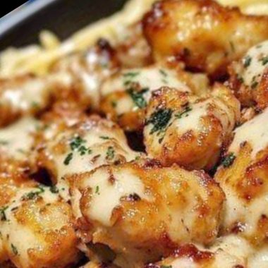 golden garlic chicken bites over creamy parmesan pasta a delicious comfort food recipe