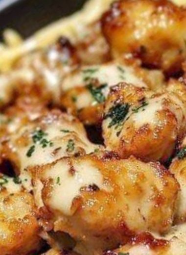 golden garlic chicken bites over creamy parmesan pasta a delicious comfort food recipe