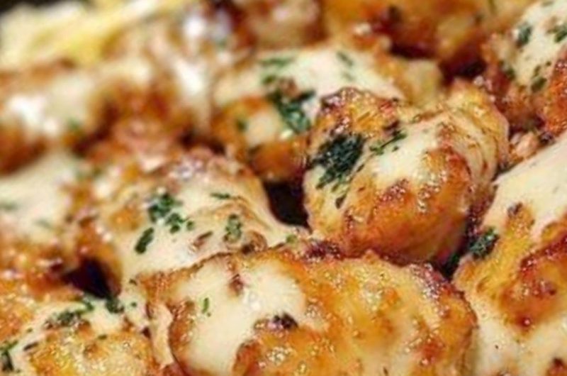 golden garlic chicken bites over creamy parmesan pasta a delicious comfort food recipe