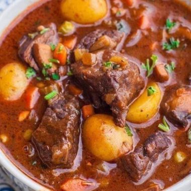 hearty red wine braised beef stew with potatoes and carrots a comforting classic