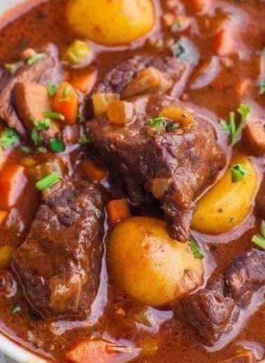 hearty red wine braised beef stew with potatoes and carrots a comforting classic