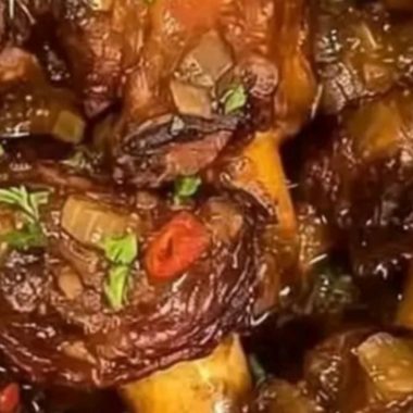 savory braised oxtails with herb infused sauce a comforting culinary masterpiece