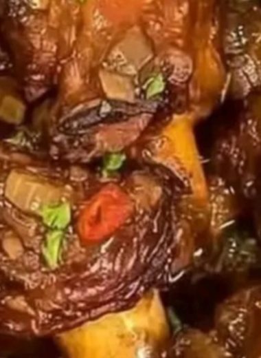 savory braised oxtails with herb infused sauce a comforting culinary masterpiece