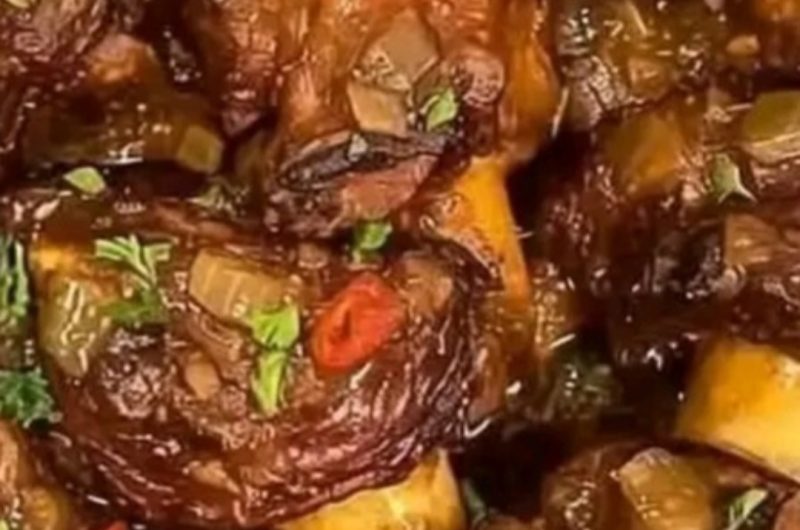 savory braised oxtails with herb infused sauce a comforting culinary masterpiece