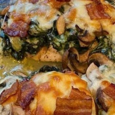 smothered chicken with creamed spinach bacon and mushrooms a hearty comfort food recipe