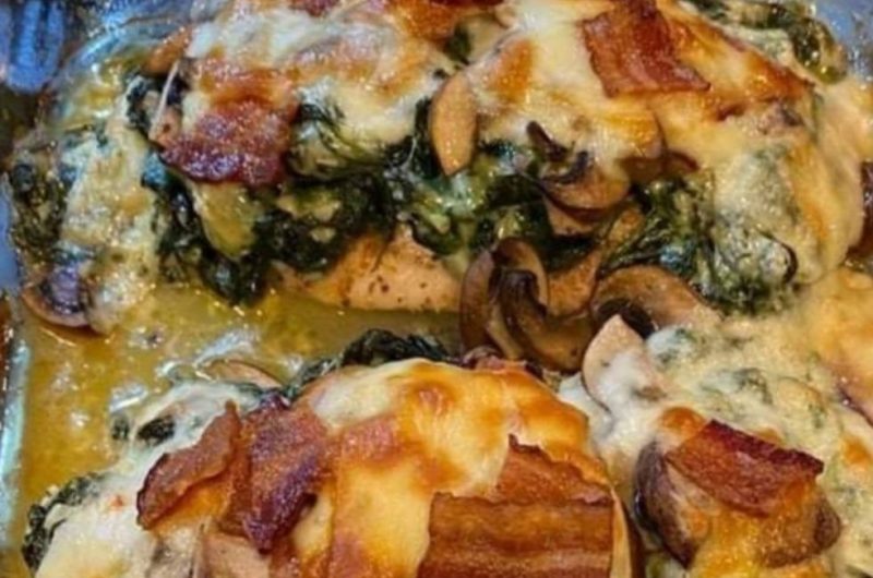 smothered chicken with creamed spinach bacon and mushrooms a hearty comfort food recipe
